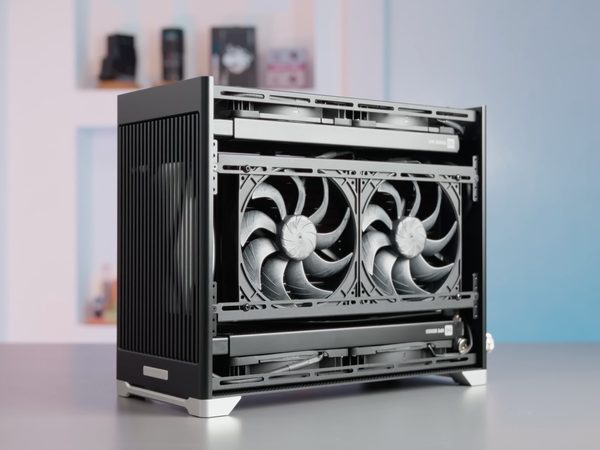 A Pantheon on a desk with two fans and the side panel off