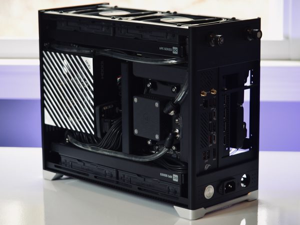 An open Pantheon build with a patterned panel, lit from behind